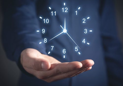 Caucasian businessman showing clock. Time Management